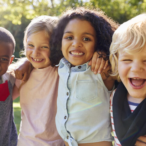 Four kids hanging out together in the garden